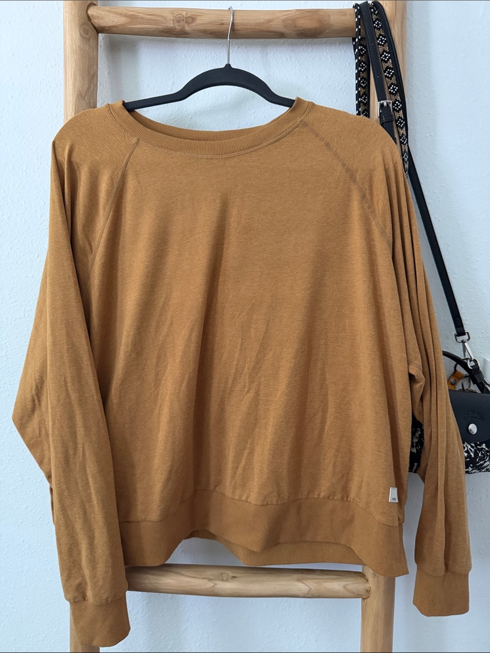 Vuori women's crew neck sweater in warm caramel